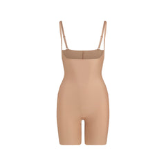 SKIMS BODY CORE SCULPT OPEN BUST MID THIGH BODYSUIT | SIENNA FLAT ON A WHITE BACKGROUND | FLT