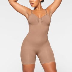 SEAMLESS SCULPT LOW BACK MID THIGH BODYSUIT WORN BY A MODEL IN FRONT VIEW, XL