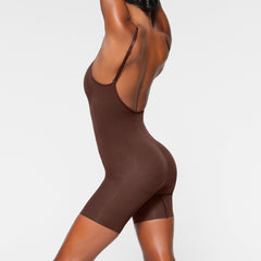 SEAMLESS SCULPT LOW BACK MID THIGH BODYSUIT ON A MODEL BACK VIEW