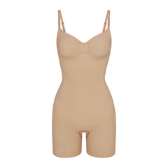 SEAMLESS SCULPT MID THIGH BODYSUIT | CLAY (ONESIES, BODYSUITS) LAYS FLAT ON A WHITE BACKGROUND | FLT