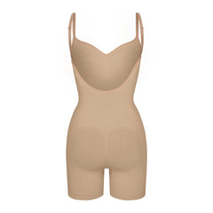 SEAMLESS SCULPT LOW BACK MID THIGH BODYSUIT LAYS FLAT ON A WHITE BACKGROUND | FLT
