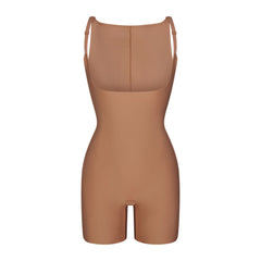 SKIMS BODY CORE SCULPT BACK SMOOTHING OPEN BUST MID THIGH BODYSUIT | SIENNA FLAT ON A WHITE BACKGROUND | FLT