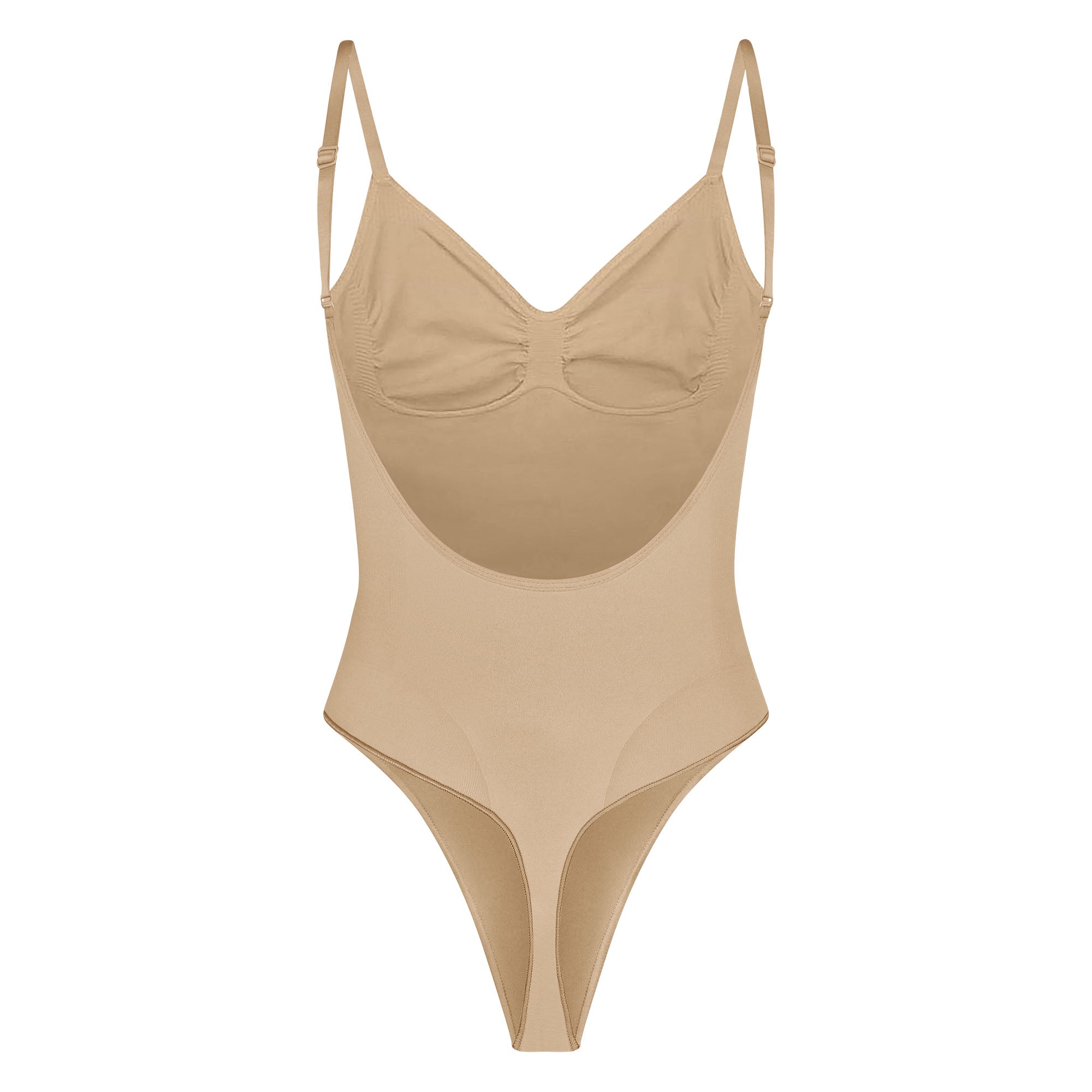 SEAMLESS SCULPT LOW BACK THONG BODYSUIT LAYS FLAT ON A WHITE BACKGROUND | FLT