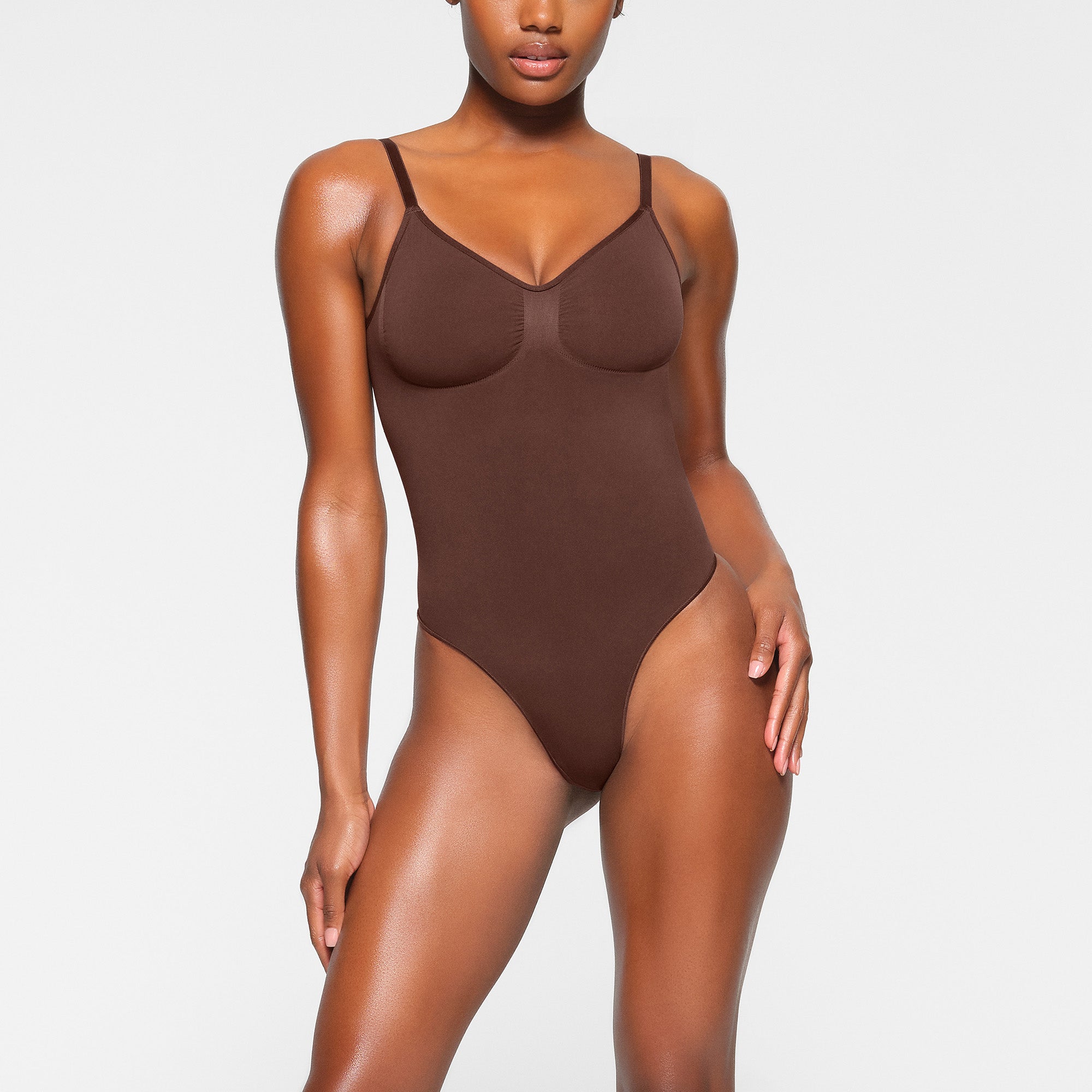 SEAMLESS SCULPT LOW BACK THONG BODYSUIT WORN BY A MODEL IN FRONT VIEW 
