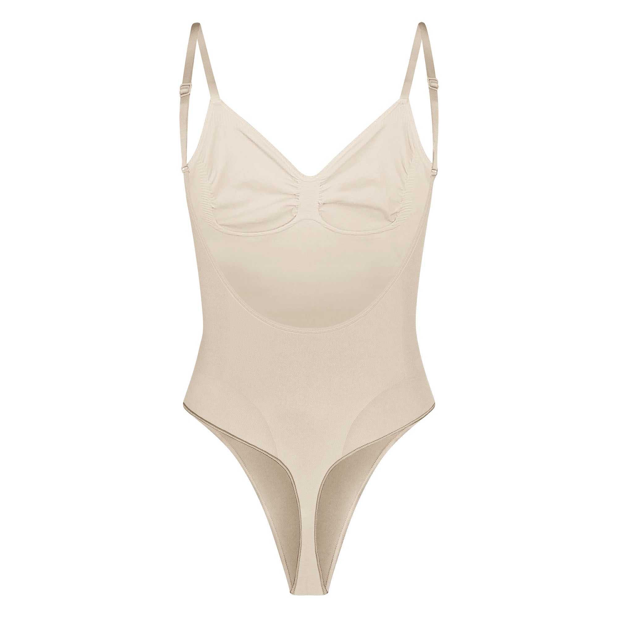 SEAMLESS SCULPT LOW BACK THONG BODYSUIT LAYS FLAT ON A WHITE BACKGROUND | FLT
