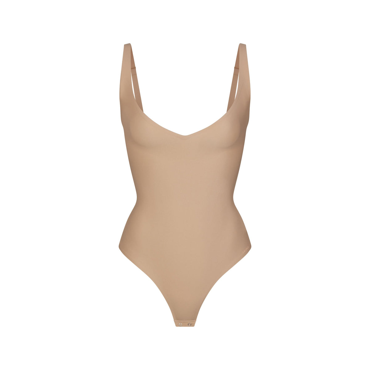 SKIMS BODY CORE SCULPT PLUNGE THONG BODYSUIT | CLAY (SHAPEWEAR BODYSUITS) FLAT ON A WHITE BACKGROUND | FLT