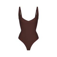 SKIMS BODY CORE SCULPT PLUNGE THONG BODYSUIT | COCOA (SHAPEWEAR BODYSUITS) FLAT ON A WHITE BACKGROUND | FLT
