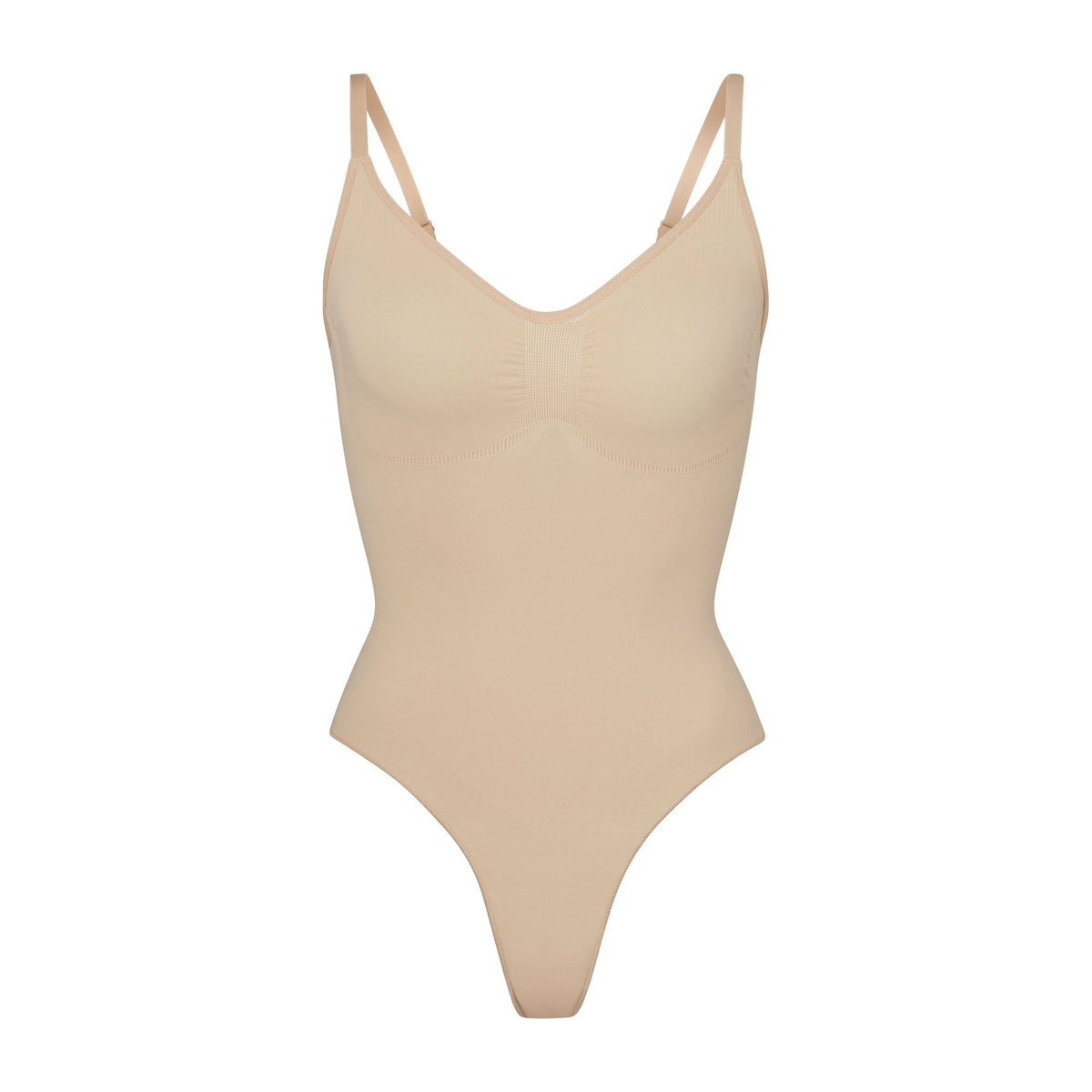 SEAMLESS SCULPT THONG BODYSUIT | MICA (SHAPEWEAR BODYSUITS) LAYS FLAT ON A WHITE BACKGROUND | FLT
