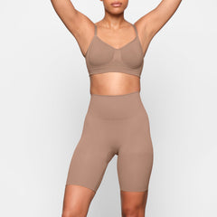 BUTT ENHANCING SHORT WORN BY A MODEL IN FRONT VIEW 