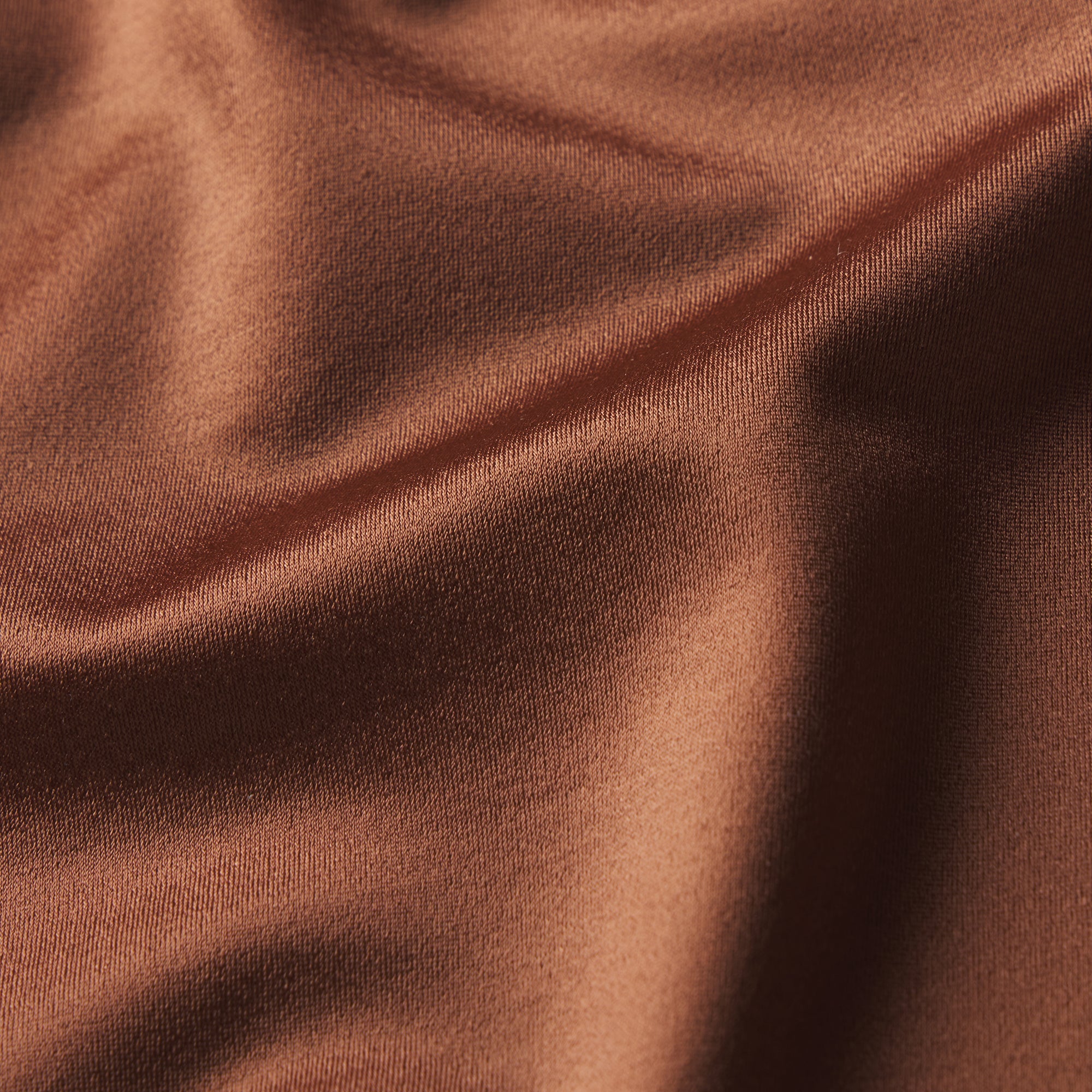 NikeSKIMS SATIN SHINE PANELED 26” LEGGING | CAROB BROWN & LAYS FLAT ON A WHITE BACKGROUND | FLT
