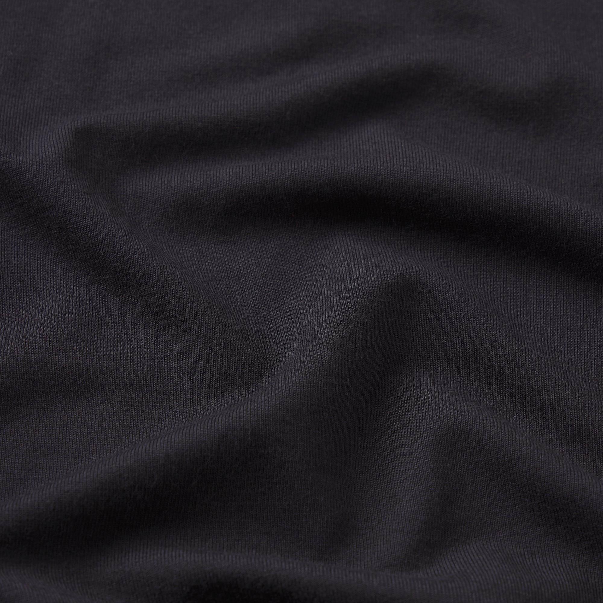 SMOOTH LAYERS HALTER TOP | OBSIDIAN ON A MODEL FRONT VIEW @ | FOCUS: 0.0, 1.0, 0.9
