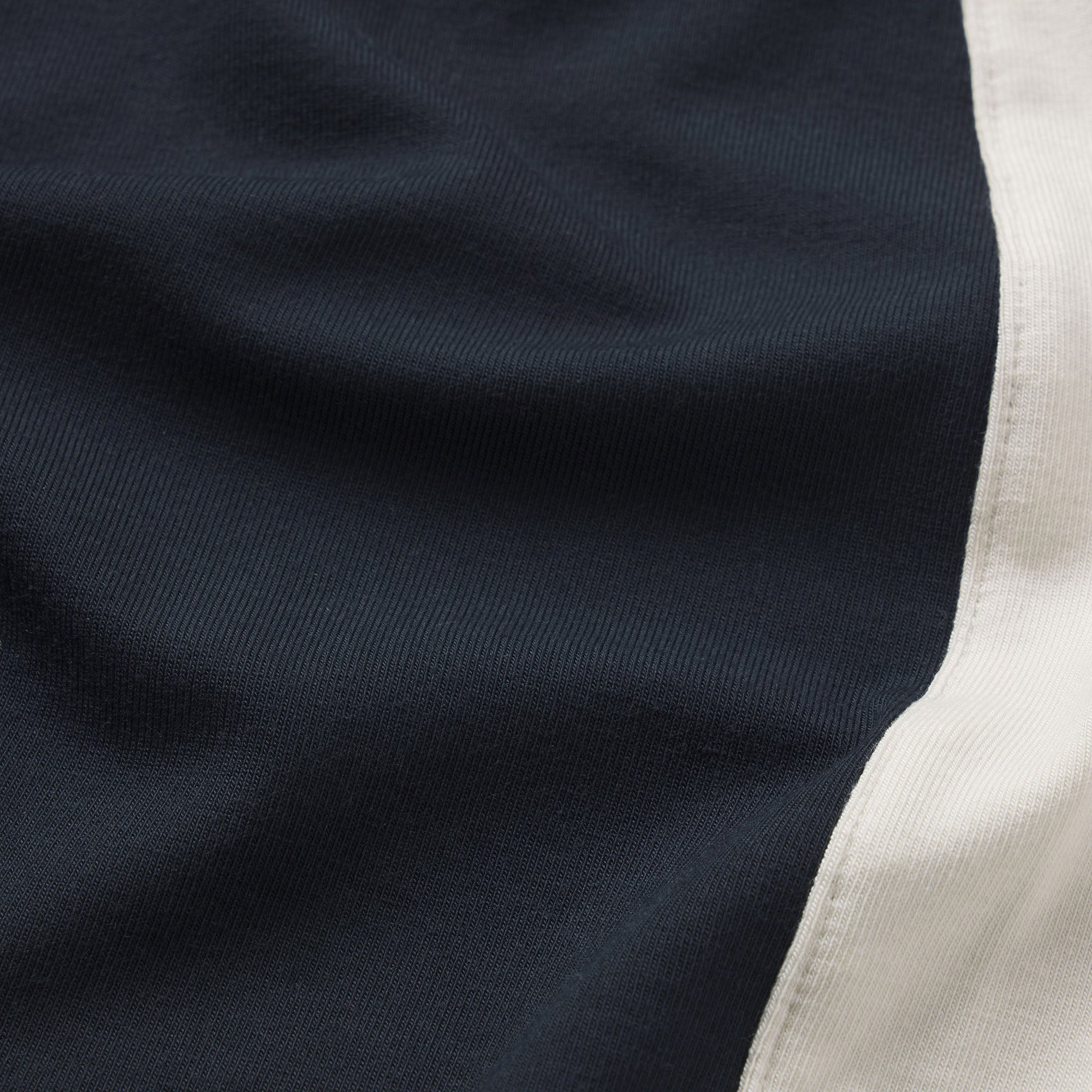 SMOOTH LAYERS MICRO SHORT | ONYX ECRU CONTRAST & LAYS FLAT ON A WHITE BACKGROUND | FLT