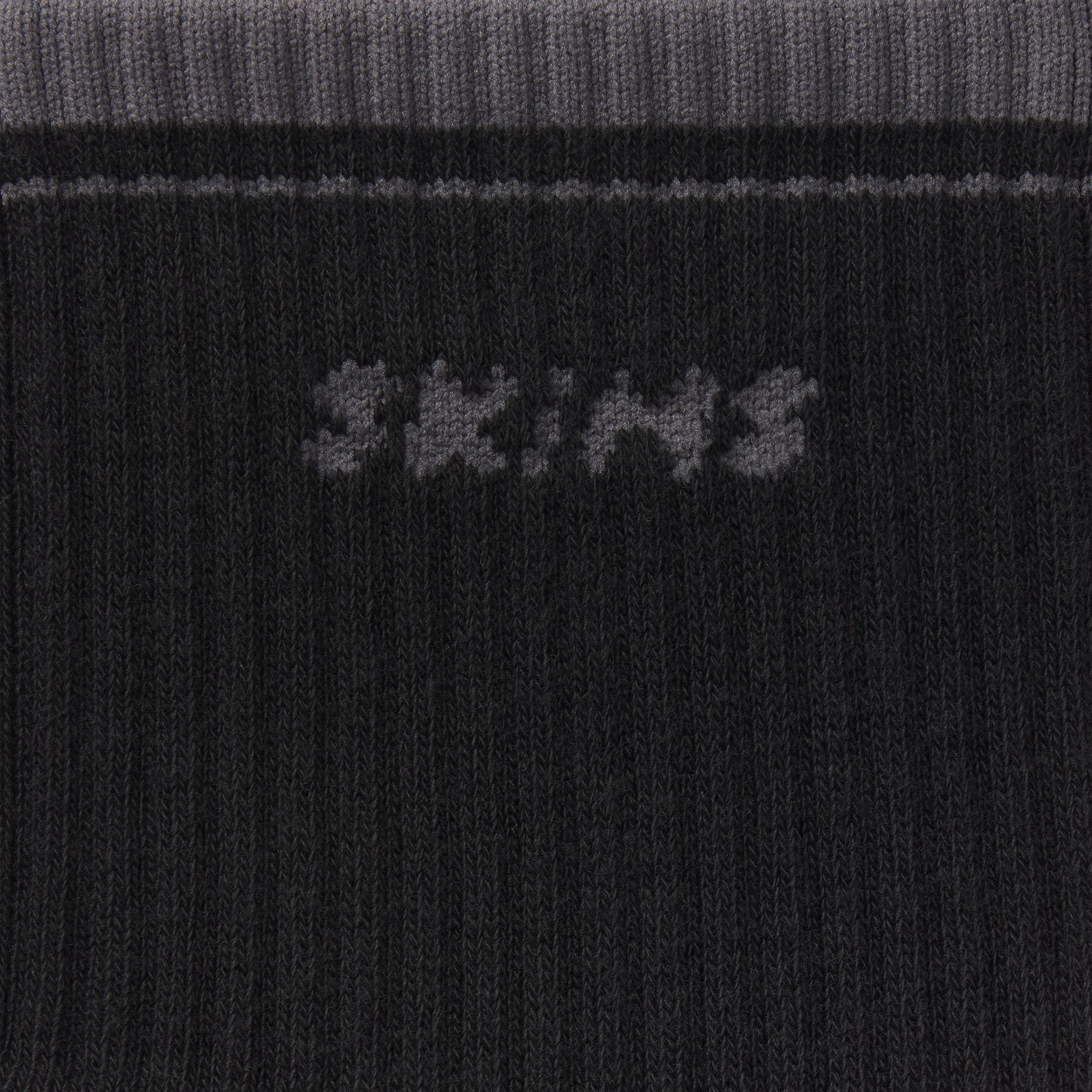 RIBBED CREW LOGO SOCK | ONYX AND DARK HEATHER GREY & LAYS FLAT ON A WHITE BACKGROUND | FLT