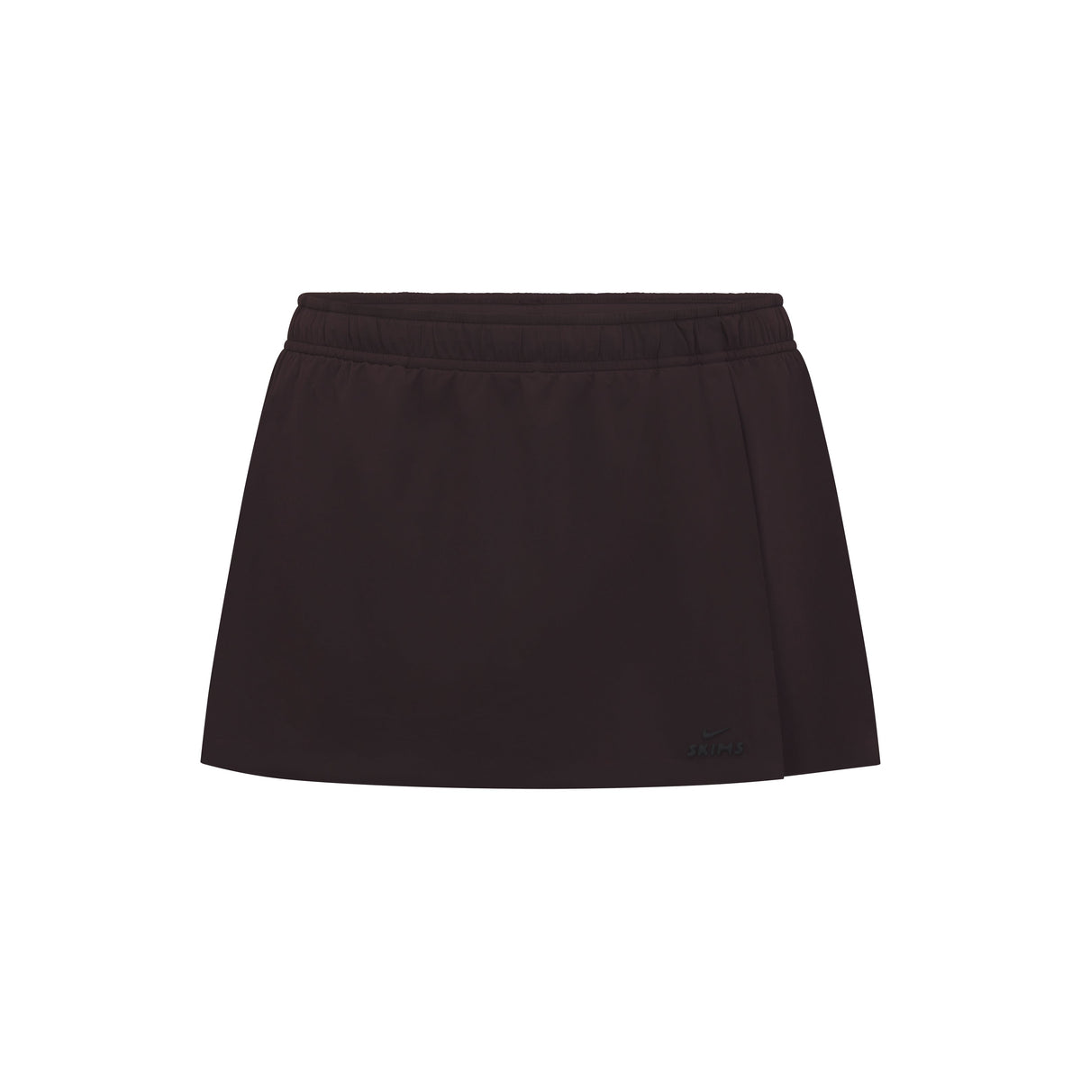 NikeSKIMS STRETCH NYLON SKORT | DARK ROAST & LAYS FLAT ON A WHITE BACKGROUND | FLT