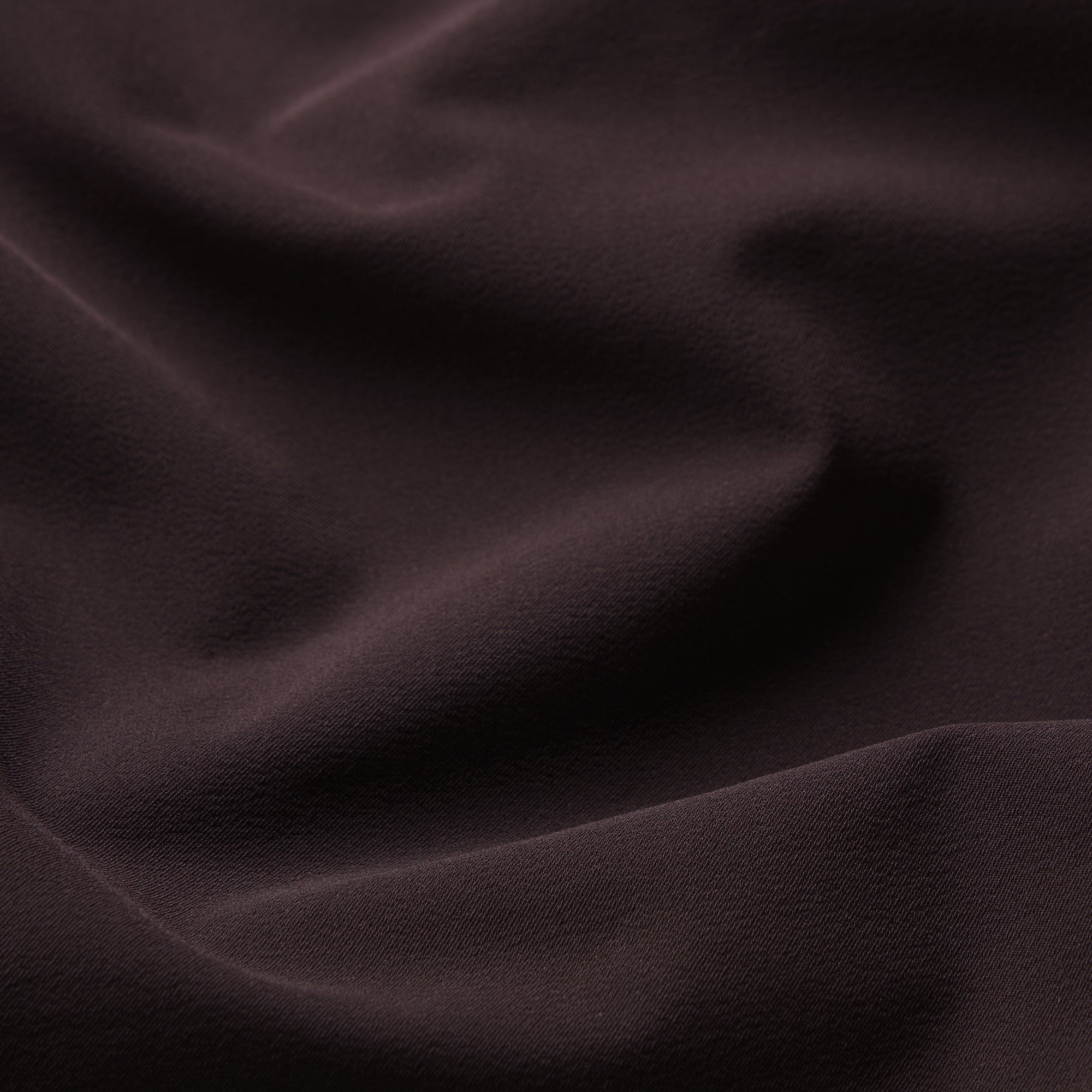 NikeSKIMS STRETCH NYLON RUNNER SHORT | DARK ROAST & LAYS FLAT ON A WHITE BACKGROUND | FLT
