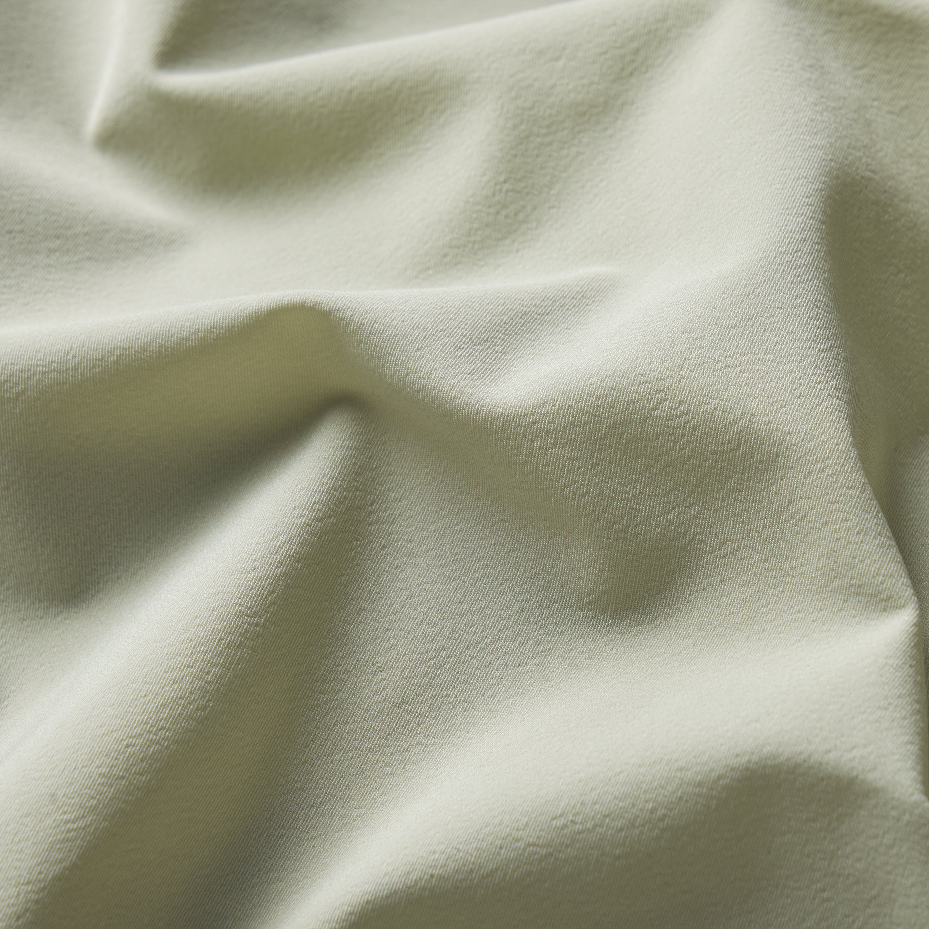 NikeSKIMS STRETCH NYLON RUNNER SHORT | TALC & LAYS FLAT ON A WHITE BACKGROUND | FLT