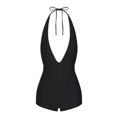 SIGNATURE SWIM PLUNGE SHORTIE ONE PIECE | ONYX LAYS FLAT ON A WHITE BACKGROUND | FLT