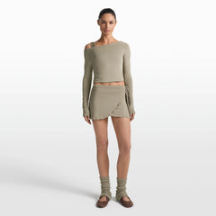 NikeSKIMS STRETCH KNIT WRAP SKIRT | DUNE ON A MODEL FRONT VIEW @ | FOCUS: 0.0, 1.0, 0.9
