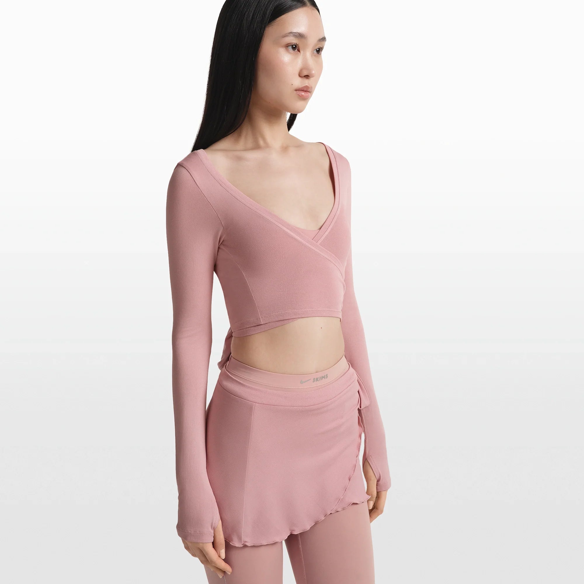 NikeSKIMS STRETCH KNIT WRAP SKIRT | HIMALAYAN ON A MODEL FRONT VIEW @ | FOCUS: 0.0, 1.0, 0.9