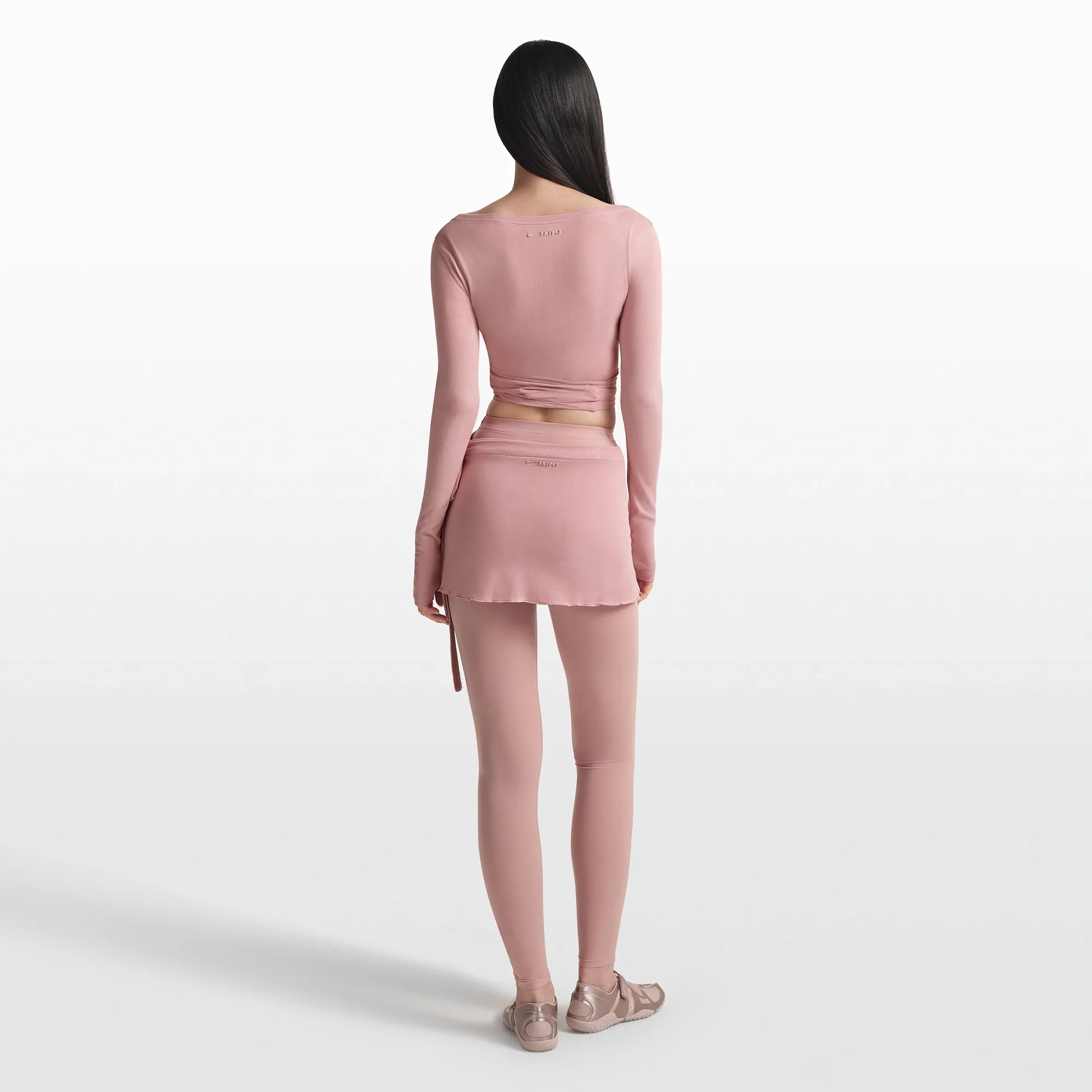 NikeSKIMS STRETCH KNIT WRAP SKIRT | HIMALAYAN ON A MODEL FRONT VIEW @ | FOCUS: 0.0, 1.0, 0.9