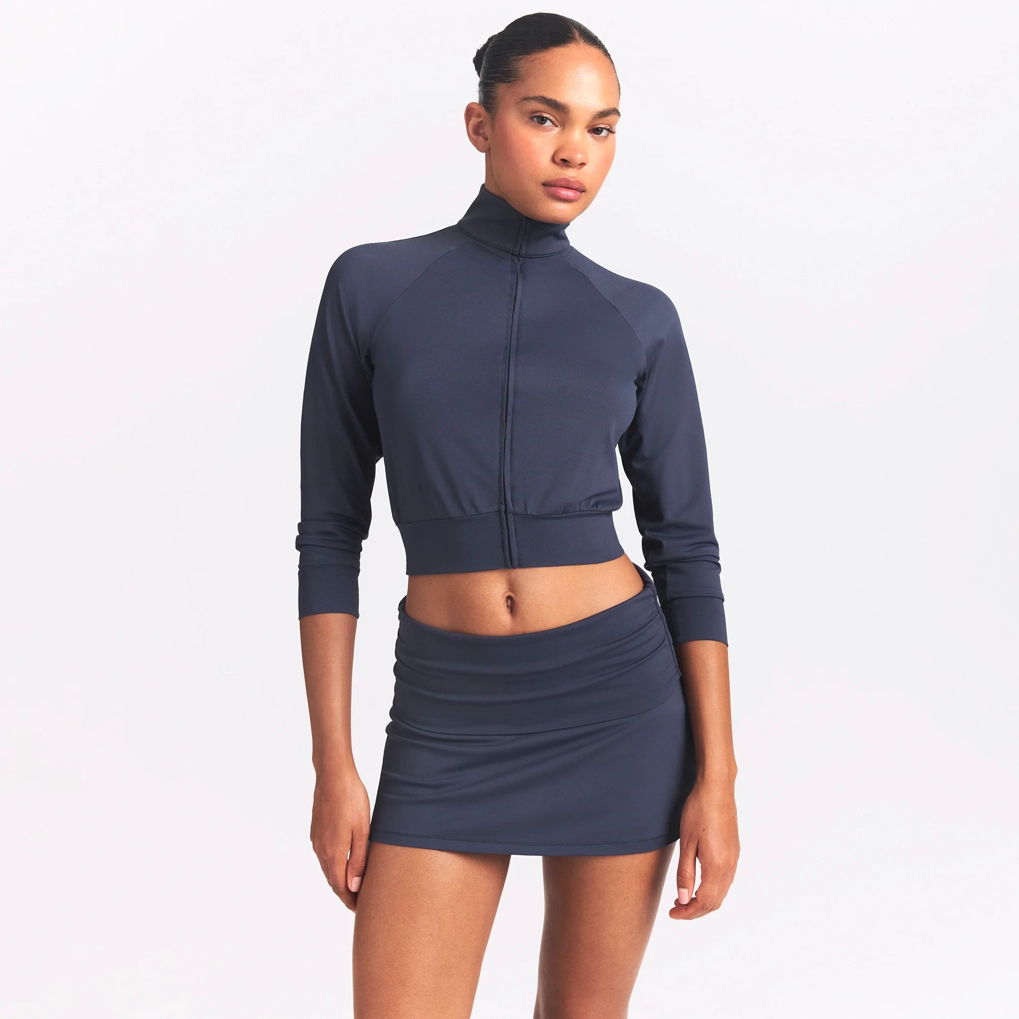 NikeSKIMS AIRY FOLDOVER SKORT | DEEP ROYAL ON A MODEL SIDE VIEW @ | FOCUS: 0.0, 1.0, 0.9