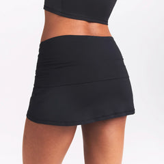 NikeSKIMS AIRY FOLDOVER SKORT | OBSIDIAN ON A MODEL SIDE VIEW @ | FOCUS: 0.0, 1.0, 0.9