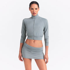 NikeSKIMS AIRY FOLDOVER SKORT | WASHED PACIFIC ON A MODEL FRONT VIEW @ | FOCUS: 0.0, 1.0, 0.9