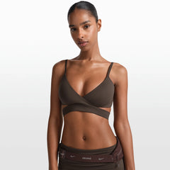 NikeSKIMS MATTE WRAP FRONT BRA | DARK SEPIA ON A MODEL FRONT VIEW @ | FOCUS: 0.0, 1.0, 0.9