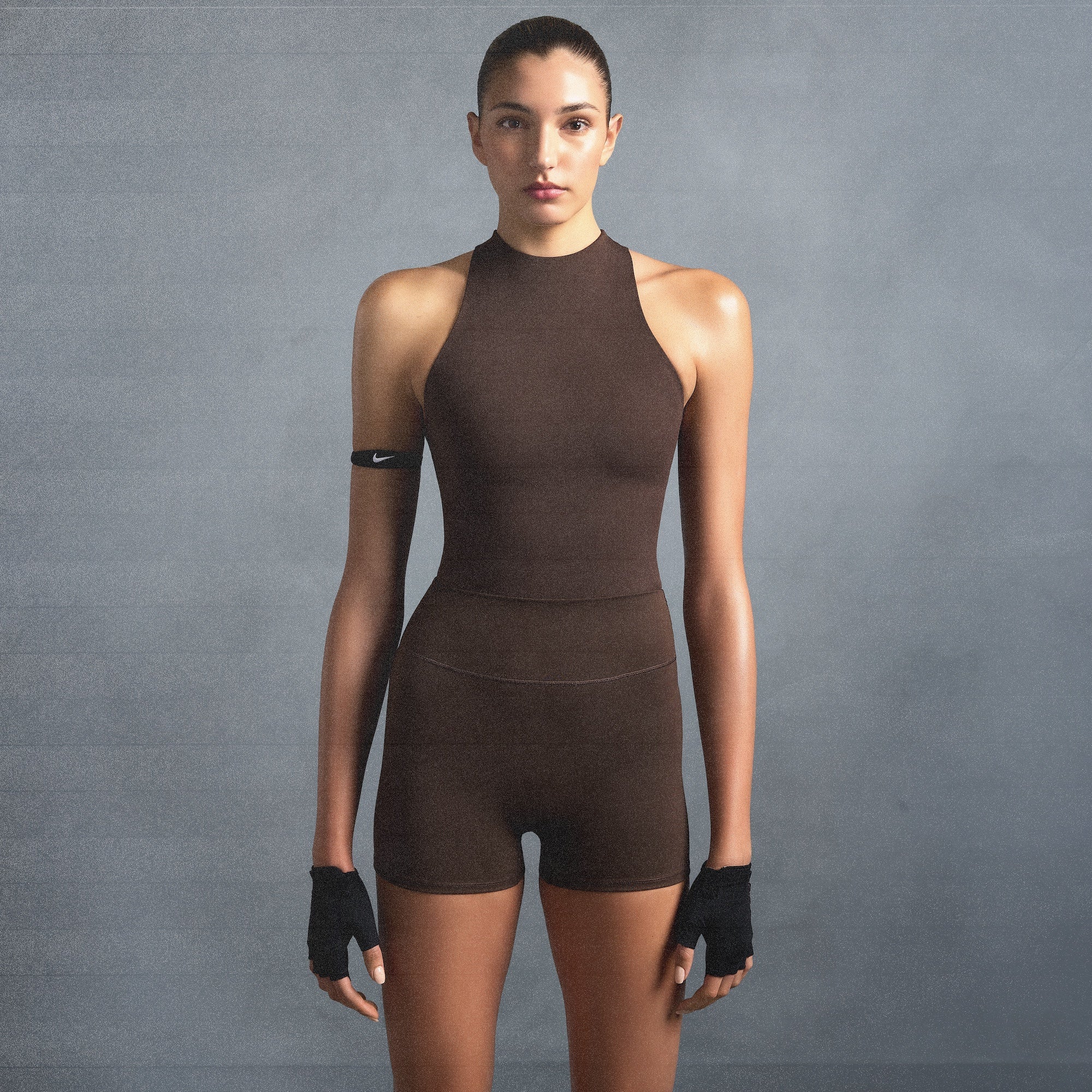 NikeSKIMS MATTE MOCK NECK RACER TANK | DARK SEPIA ON A MODEL SIDE VIEW @ | FOCUS: 0.0, 1.0, 0.9
