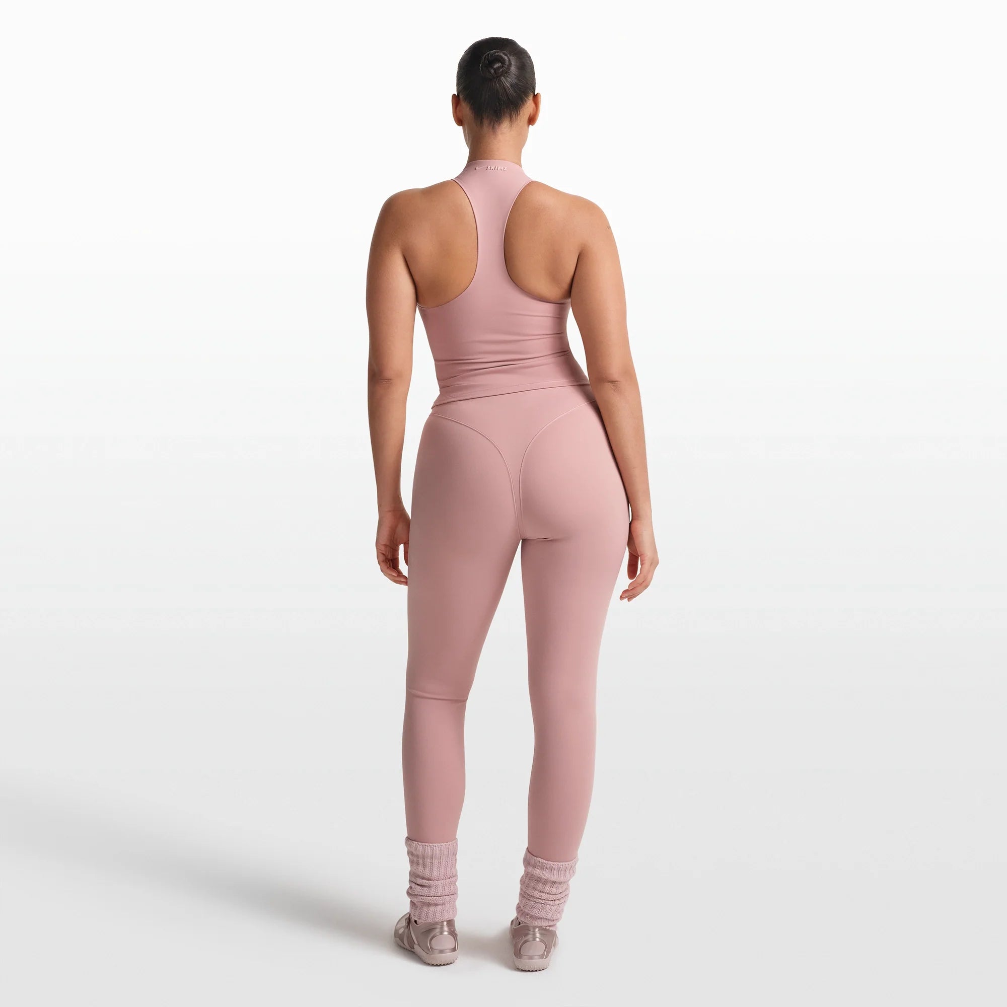 NikeSKIMS MATTE MOCK NECK RACER TANK | HIMALAYAN ON A MODEL FRONT VIEW @ | FOCUS: 0.0, 1.0, 0.9