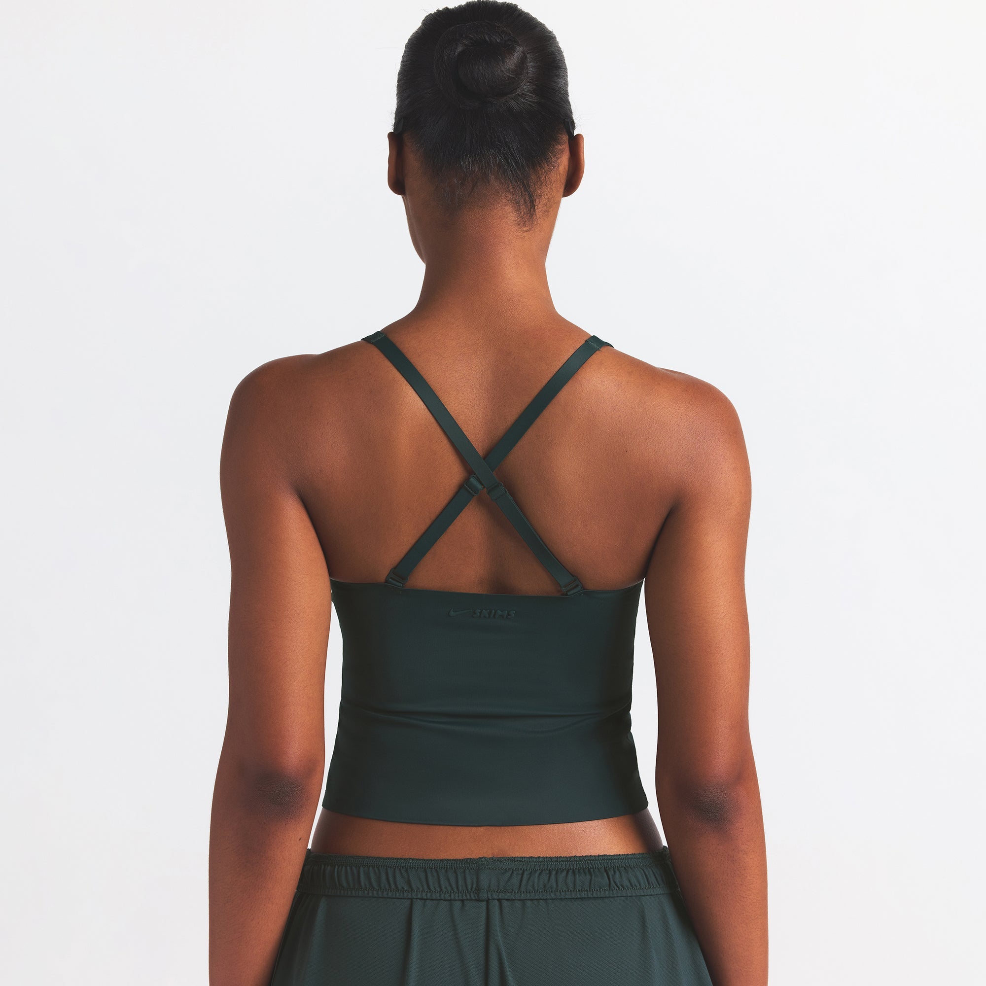 NikeSKIMS SHINE V-NECK TANK | DARK TEAL ON A MODEL SIDE VIEW @ | FOCUS: 0.0, 1.0, 0.9