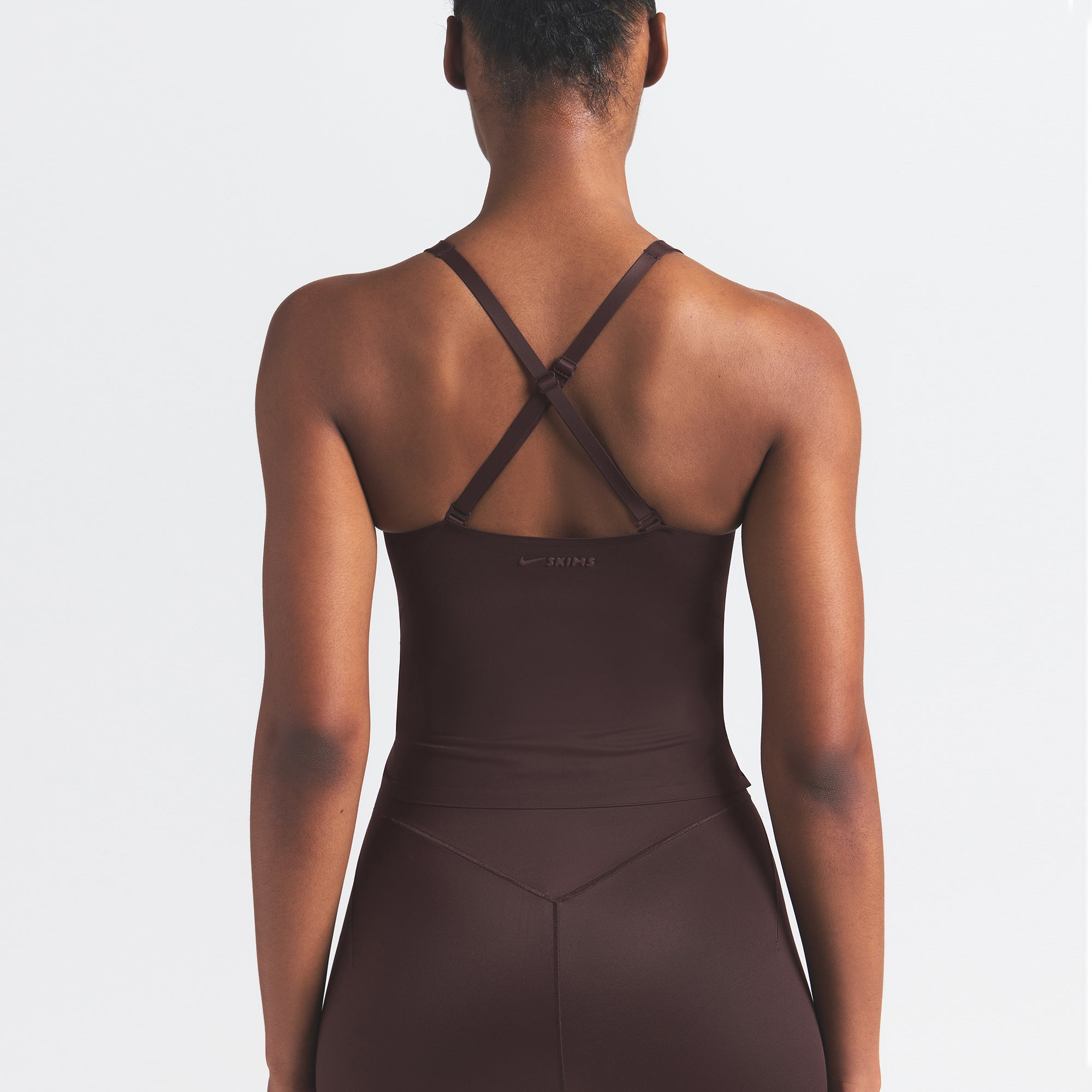 NikeSKIMS SHINE V-NECK TANK | PHOENIX ON A MODEL SIDE VIEW