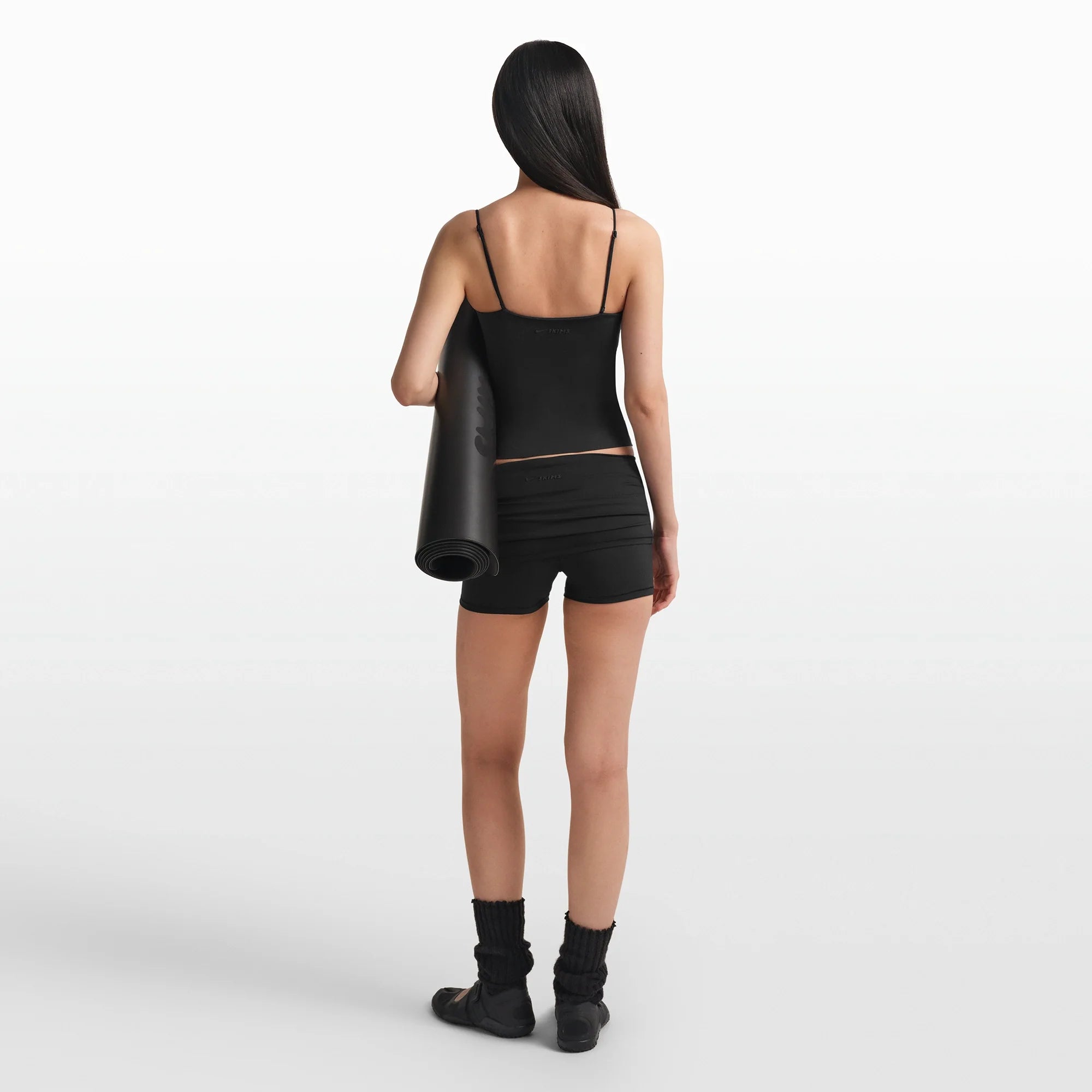 NikeSKIMS MATTE SHIRRED FRONT TANK | OBSIDIAN ON A MODEL FRONT VIEW @ | FOCUS: 0.0, 1.0, 0.9