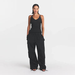SHEER KNIT PLUNGE TANK | ONYX ON A MODEL FRONT VIEW @ | FOCUS: 0.0, 1.0, 0.9