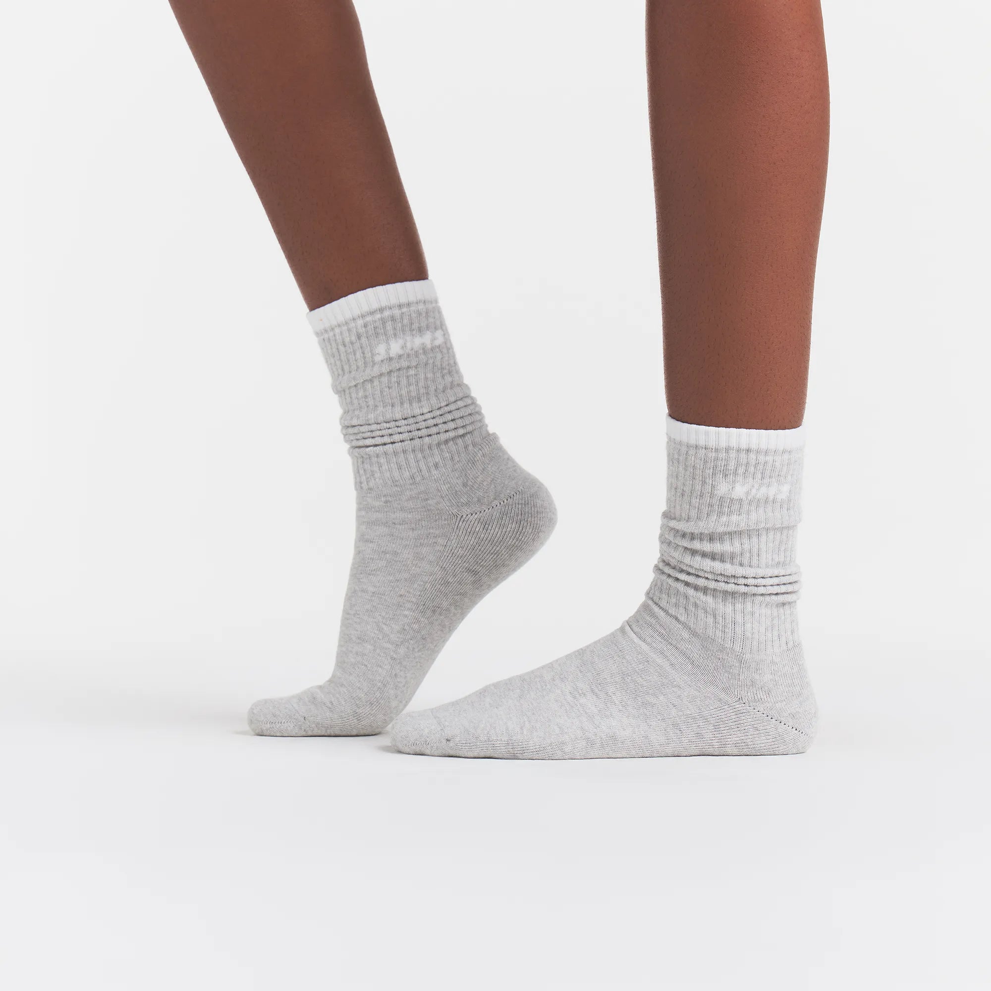 RIBBED CREW LOGO SOCK | LIGHT HEATHER GREY AND SNOW ON A MODEL | FOCUS: 0.0, 1.0, 0.9