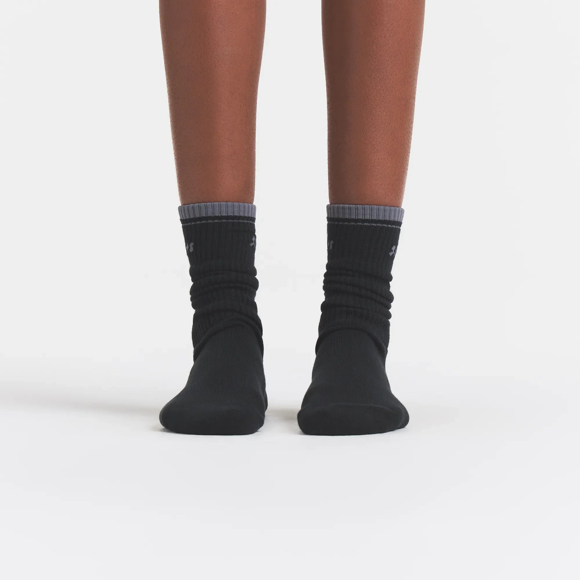 RIBBED CREW LOGO SOCK | ONYX AND DARK HEATHER GREY ON A MODEL | FOCUS: 0.0, 1.0, 0.9