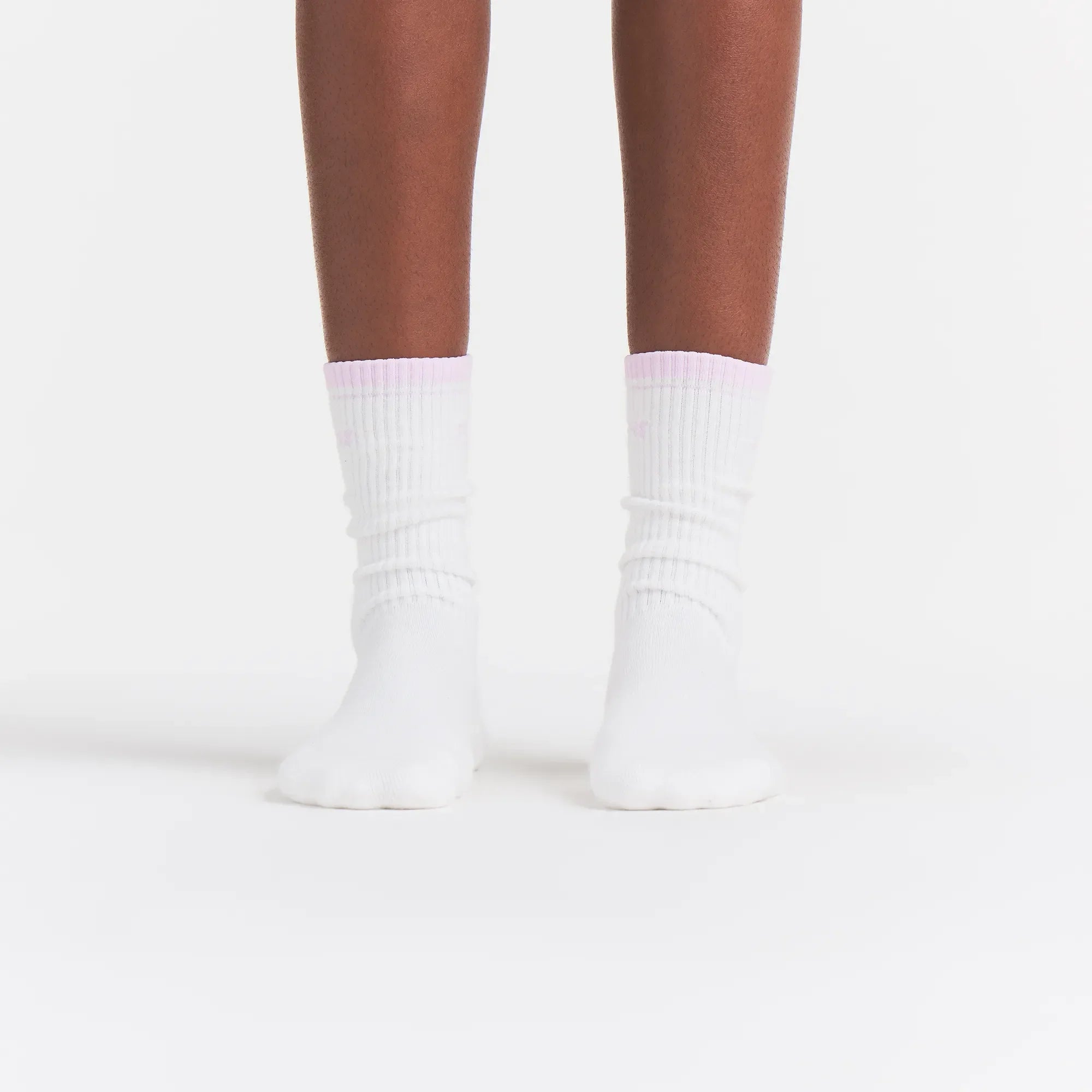 RIBBED CREW LOGO SOCK | SNOW AND CHERRY BLOSSOM ON A MODEL | FOCUS: 0.0, 1.0, 0.9
