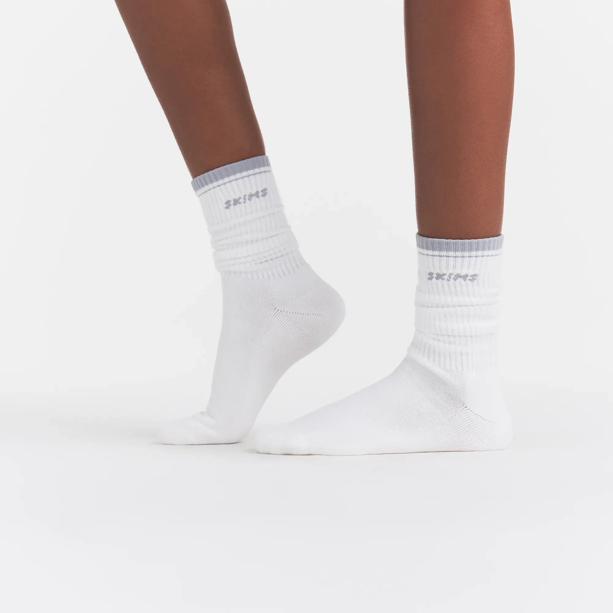 RIBBED CREW LOGO SOCK | SNOW AND LIGHT HEATHER GREY ON A MODEL | FOCUS: 0.0, 1.0, 0.9