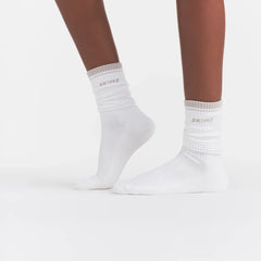 RIBBED CREW LOGO SOCK | SNOW AND STONE ON A MODEL | FOCUS: 0.0, 1.0, 0.9