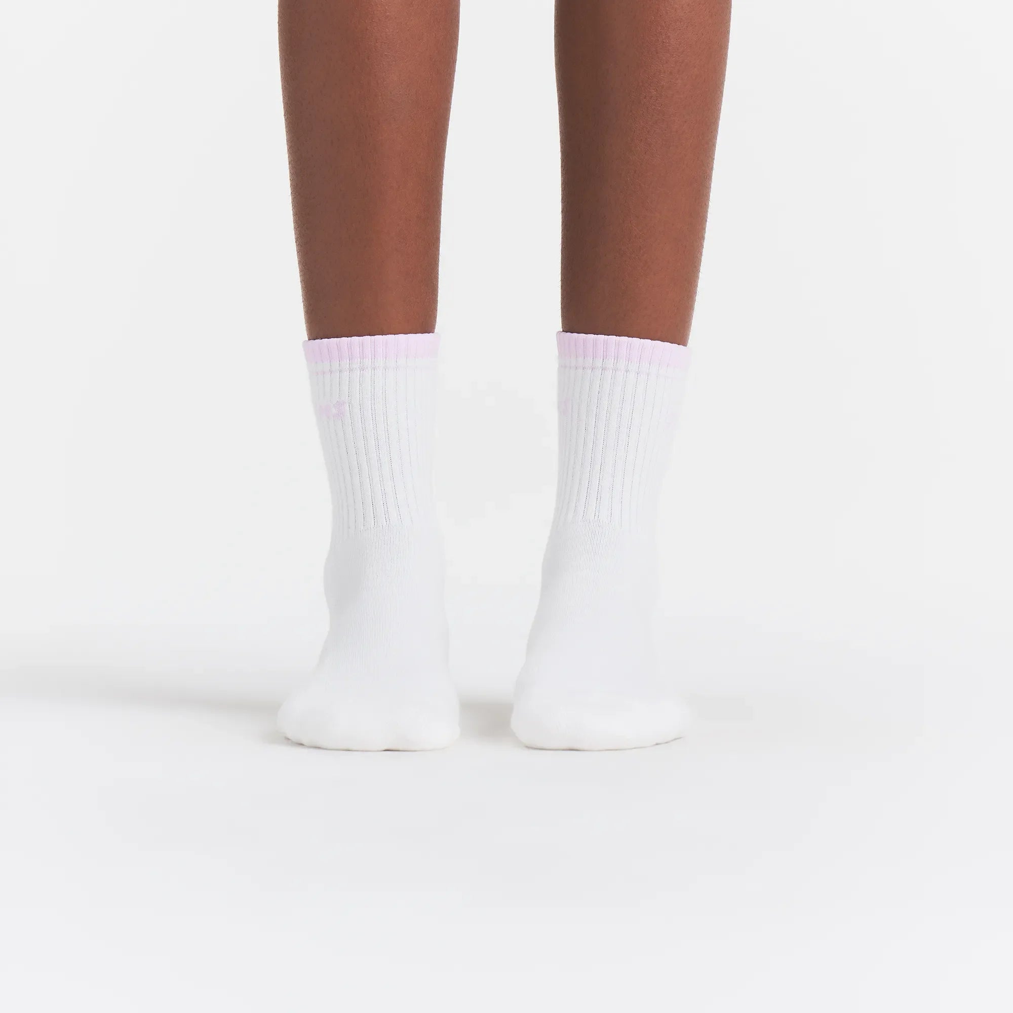 RIBBED QUARTER CREW LOGO SOCK | SNOW AND CHERRY BLOSSOM ON A MODEL | FOCUS: 0.0, 1.0, 0.9