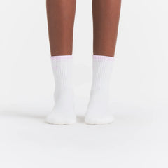 RIBBED QUARTER CREW LOGO SOCK | SNOW AND CHERRY BLOSSOM ON A MODEL | FOCUS: 0.0, 1.0, 0.9