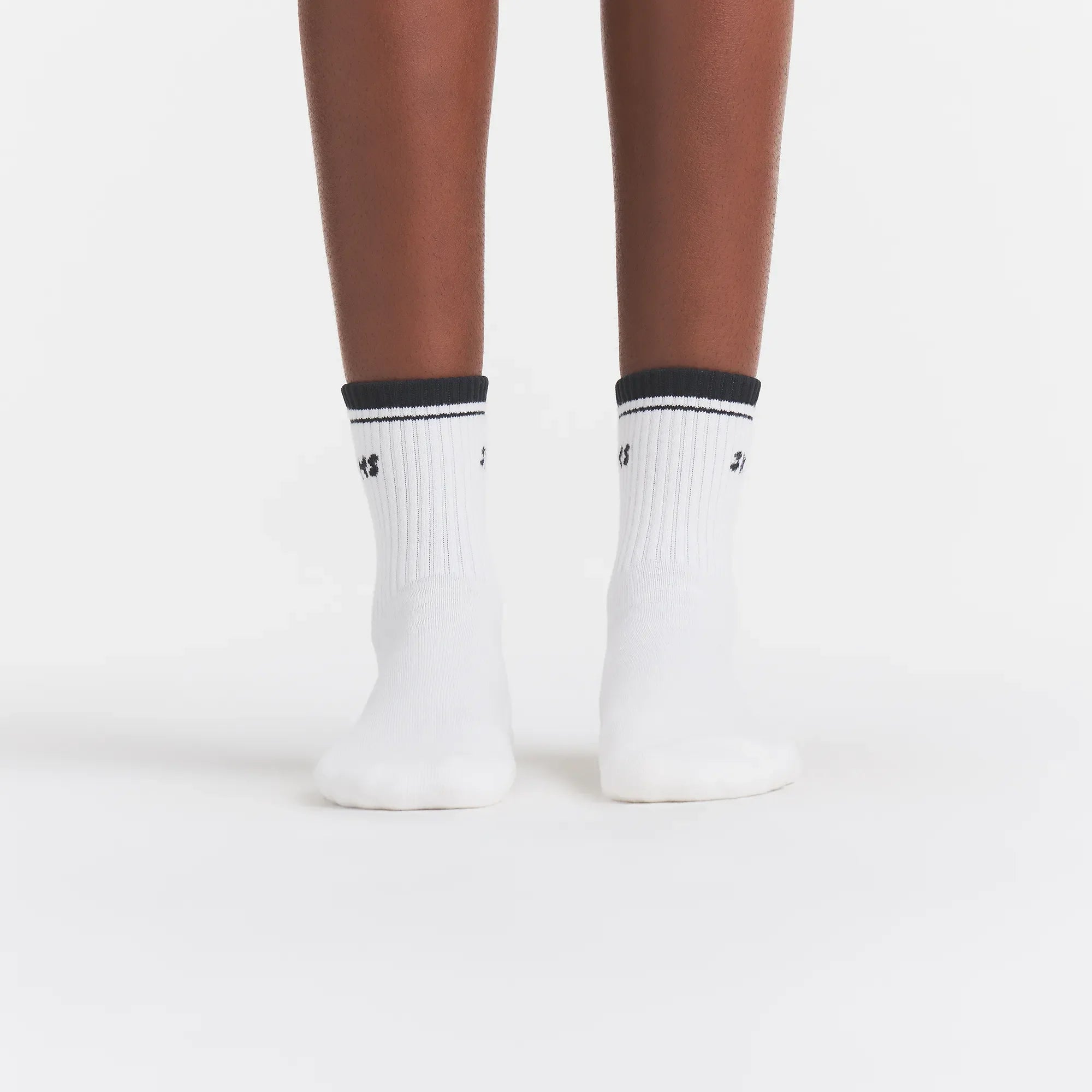 RIBBED QUARTER CREW LOGO SOCK | SNOW AND ONYX ON A MODEL | FOCUS: 0.0, 1.0, 0.9