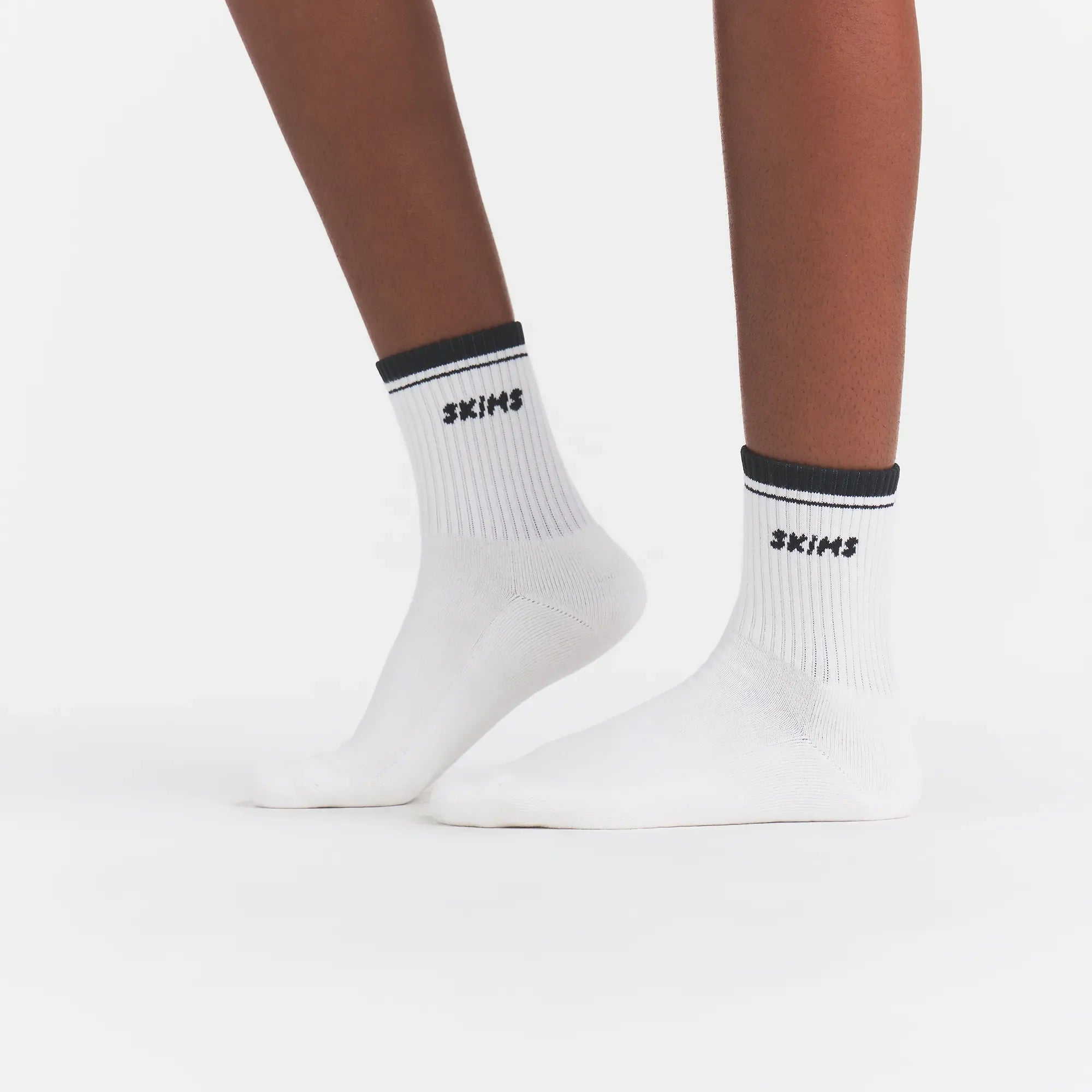 RIBBED QUARTER CREW LOGO SOCK | SNOW AND ONYX ON A MODEL | FOCUS: 0.0, 1.0, 0.9