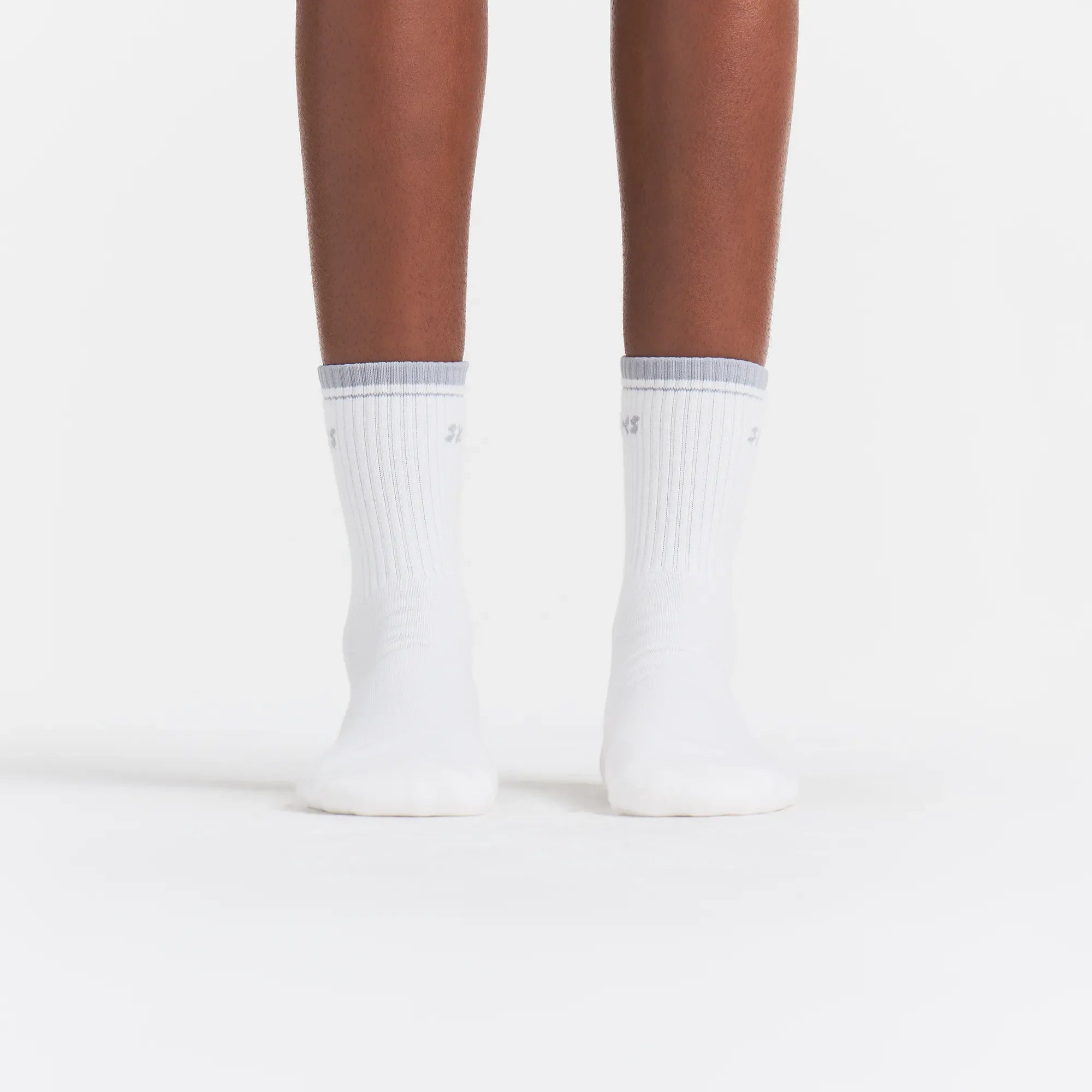 RIBBED QUARTER CREW LOGO SOCK | SNOW AND LIGHT HEATHER GREY ON A MODEL | FOCUS: 0.0, 1.0, 0.9