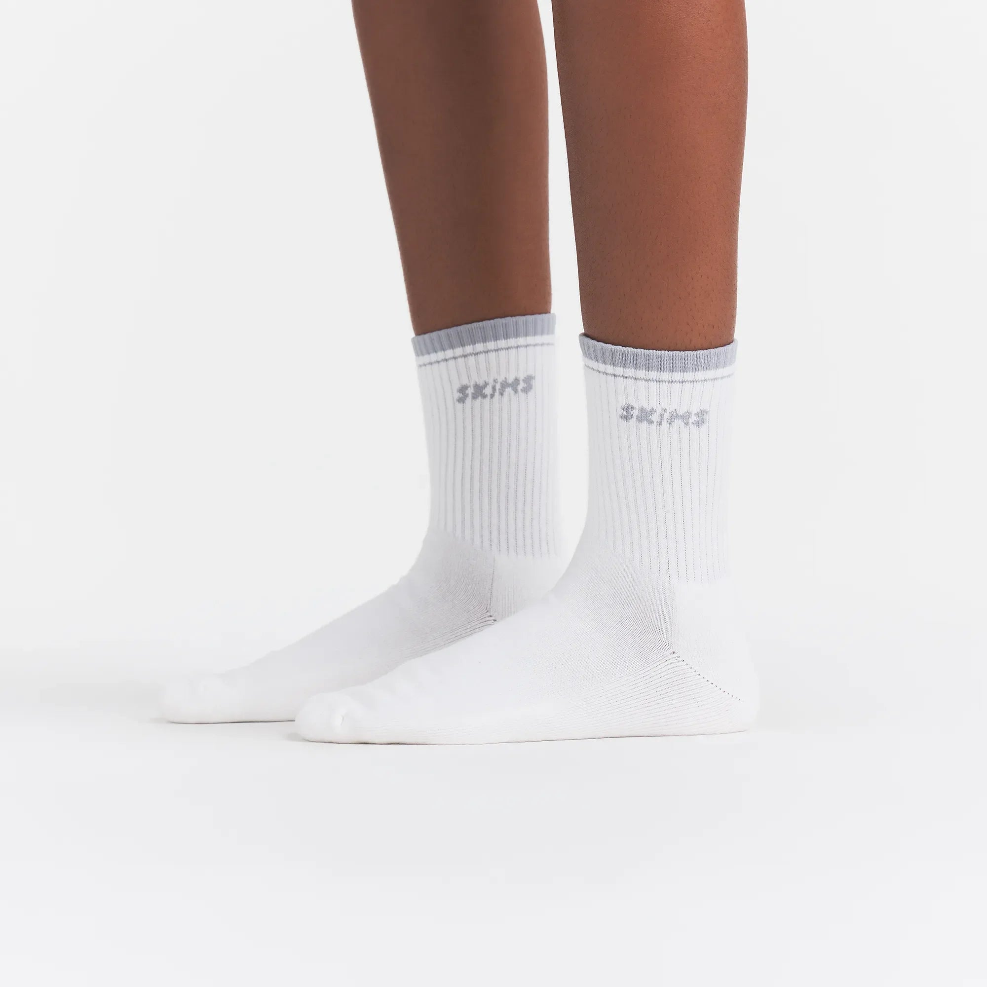 RIBBED QUARTER CREW LOGO SOCK | SNOW AND LIGHT HEATHER GREY ON A MODEL | FOCUS: 0.0, 1.0, 0.9