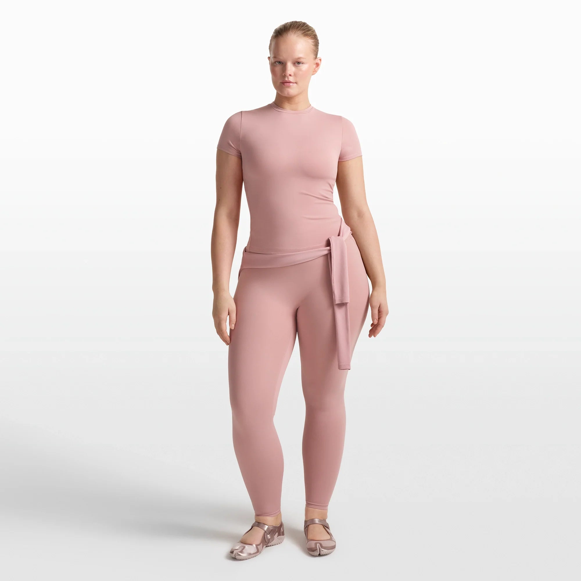 NikeSKIMS MATTE PADDED BABY TEE | HIMALAYAN ON A MODEL FRONT VIEW @ | FOCUS: 0.0, 1.0, 0.9