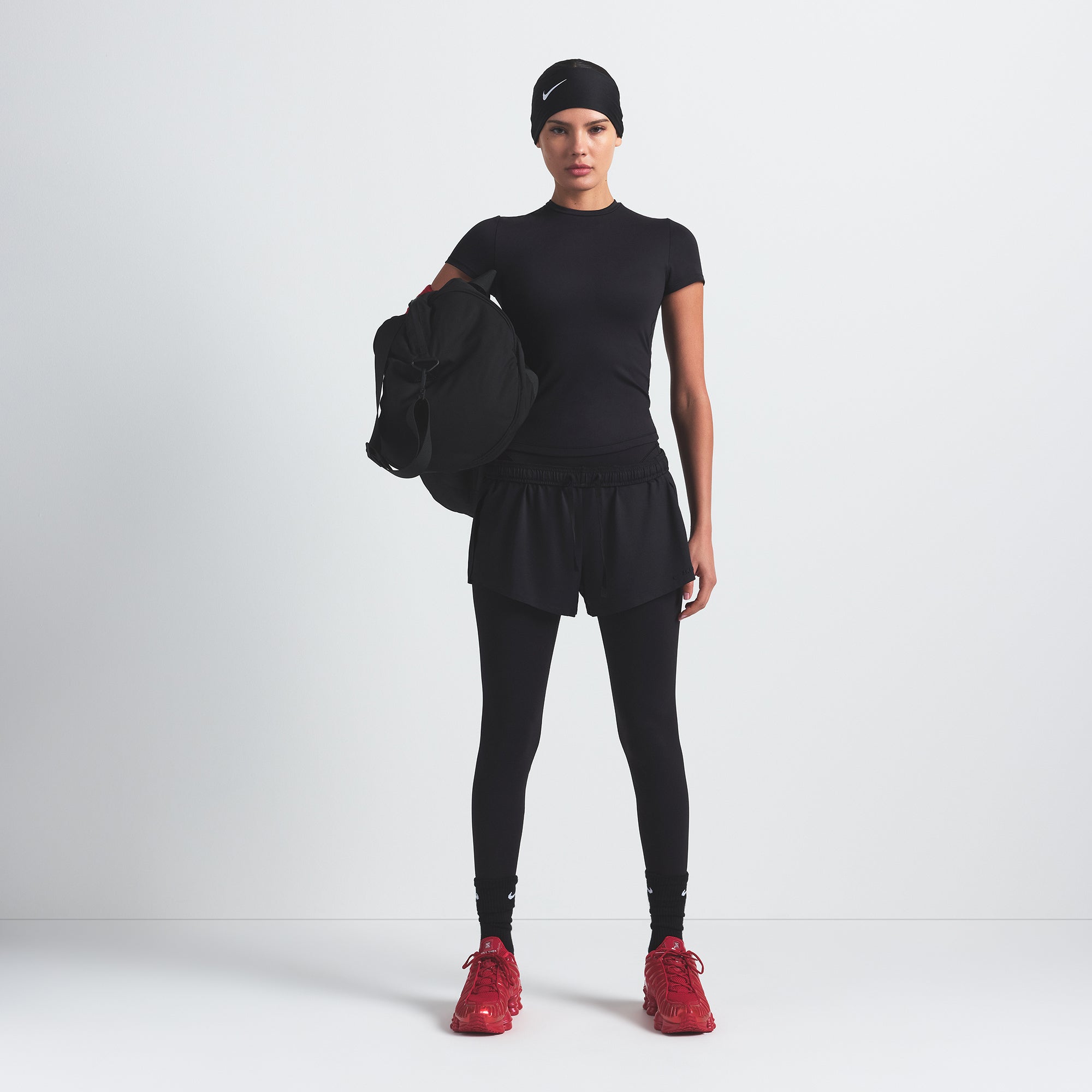 NikeSKIMS MATTE PADDED BABY TEE | OBSIDIAN ON A MODEL FRONT VIEW @ | FOCUS: 0.0, 1.0, 0.9
