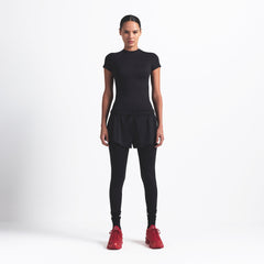 NikeSKIMS MATTE PADDED BABY TEE | OBSIDIAN ON A MODEL FRONT VIEW @ | FOCUS: 0.0, 1.0, 0.9