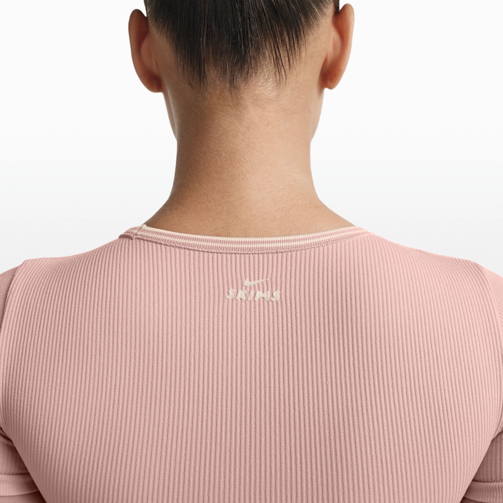 NikeSKIMS RIBBED SEAMLESS BABY TEE | HIMALAYAN/ECRU ON A MODEL FRONT VIEW @ | FOCUS: 0.0, 1.0, 0.9