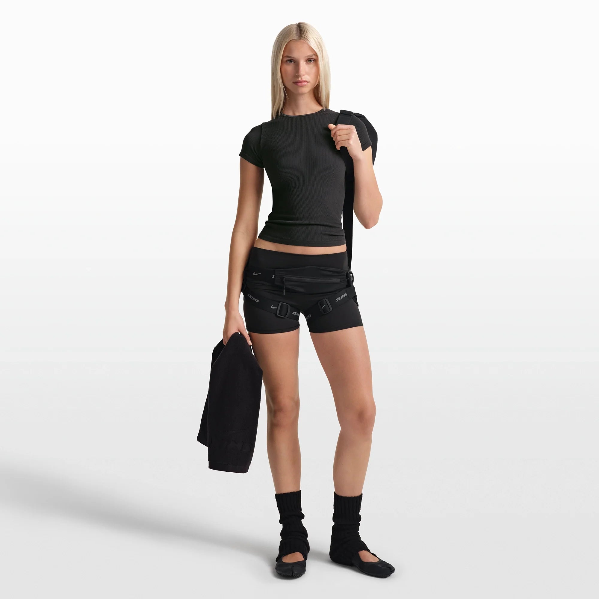 NikeSKIMS RIBBED SEAMLESS BABY TEE | OBSIDIAN/ARMOR ON A MODEL FRONT VIEW @ | FOCUS: 0.0, 1.0, 0.9